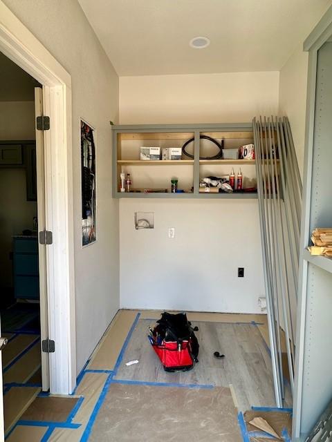 laundry area featuring wood finished floors