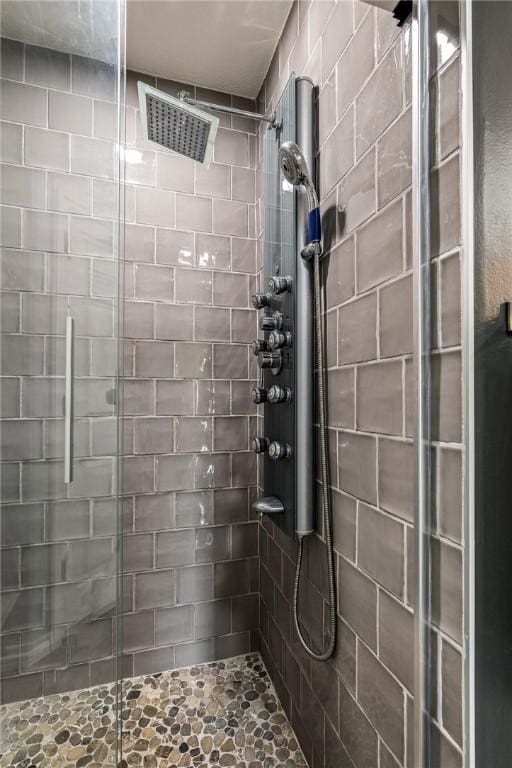bathroom featuring a shower stall