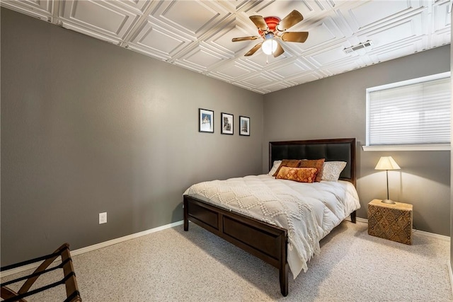 bedroom featuring an ornate ceiling, baseboards, visible vents, and ceiling fan