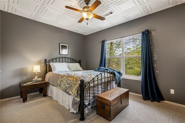 bedroom with baseboards, ceiling fan, light carpet, and visible vents