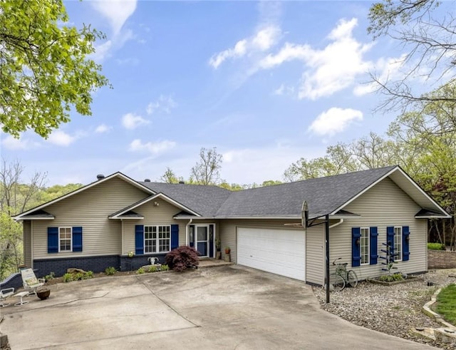 ranch-style house with an attached garage and driveway