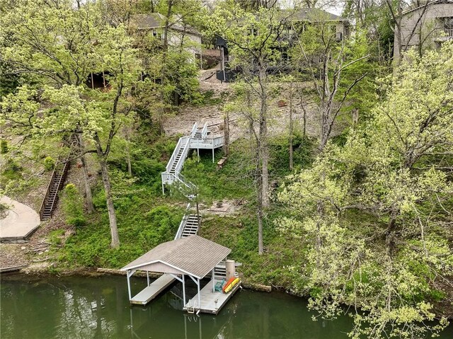 57 Dunsford Dr, Bella Vista, AR 72715 - dock area featuring stairs, boat lift, and a water view