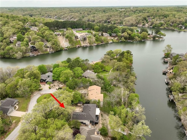 aerial view with a water view, a residential view, and a wooded view