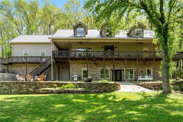 13248 N Old Wire Rd, Rogers, AR 72756 - rear view of house with a ceiling fan, stairway, a lawn, and a deck