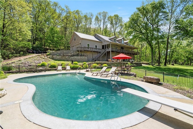 13248 N Old Wire Rd, Rogers, AR 72756 - view of pool with a patio area, a diving board, and view of scattered trees