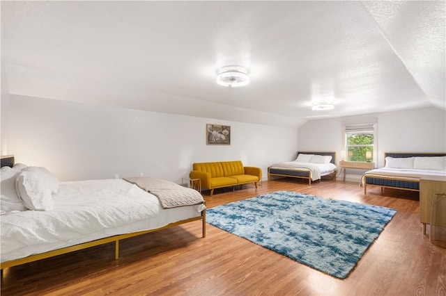 13248 N Old Wire Rd, Rogers, AR 72756 - bedroom featuring vaulted ceiling and wood finished floors
