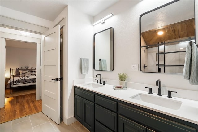 13248 N Old Wire Rd, Rogers, AR 72756 - ensuite bathroom featuring double vanity, tile patterned flooring, and a shower