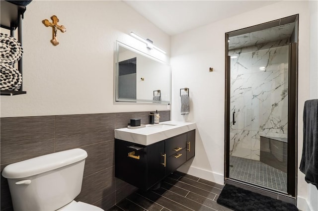 13248 N Old Wire Rd, Rogers, AR 72756 - bathroom with a marble finish shower, toilet, vanity, and wood finish floors