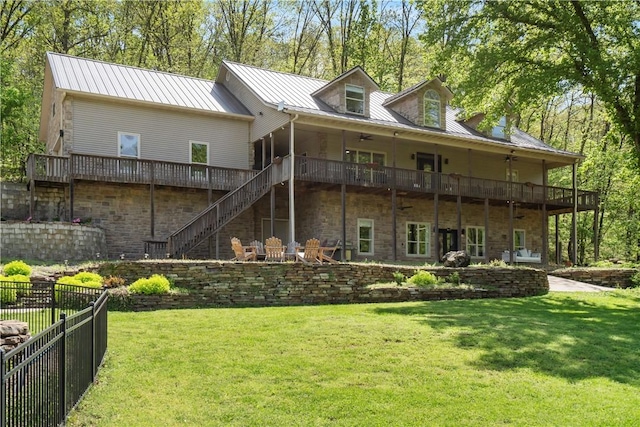 13248 N Old Wire Rd, Rogers, AR 72756 - rear view of house featuring stairs, a wooden deck, metal roof, and stone siding