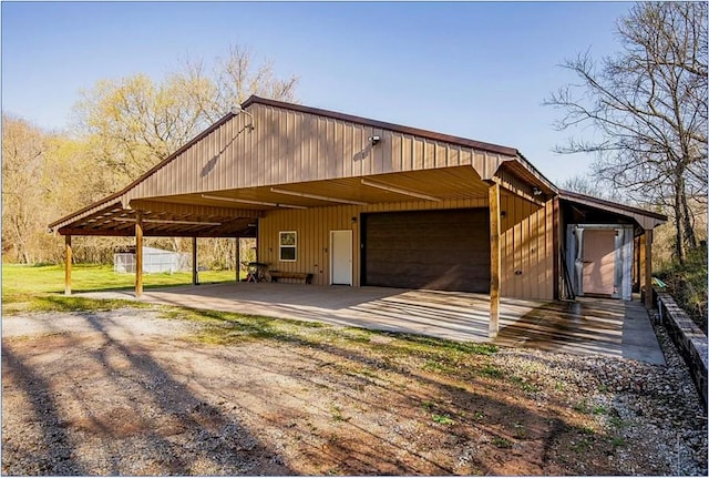 13248 N Old Wire Rd, Rogers, AR 72756 - view of front of home featuring a garage and an outbuilding