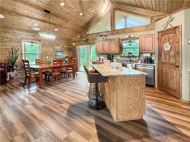 kitchen with light wood-type flooring, wood ceiling, dishwasher, and high vaulted ceiling