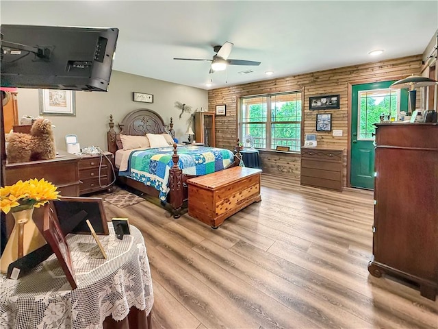 bedroom with a ceiling fan, recessed lighting, light wood finished floors, and visible vents