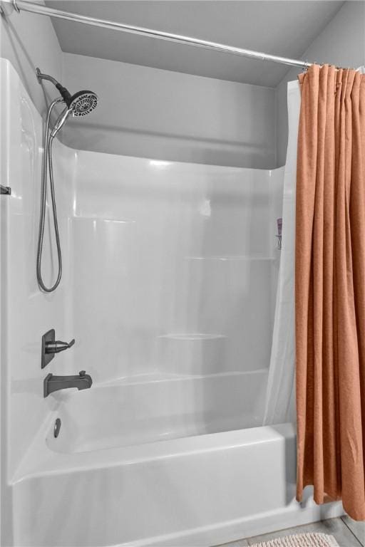 full bathroom featuring shower / bath combination with curtain