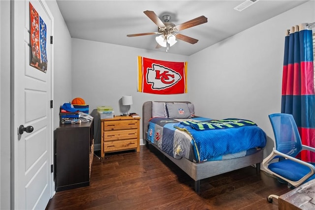 bedroom with a ceiling fan, visible vents, and hardwood / wood-style floors