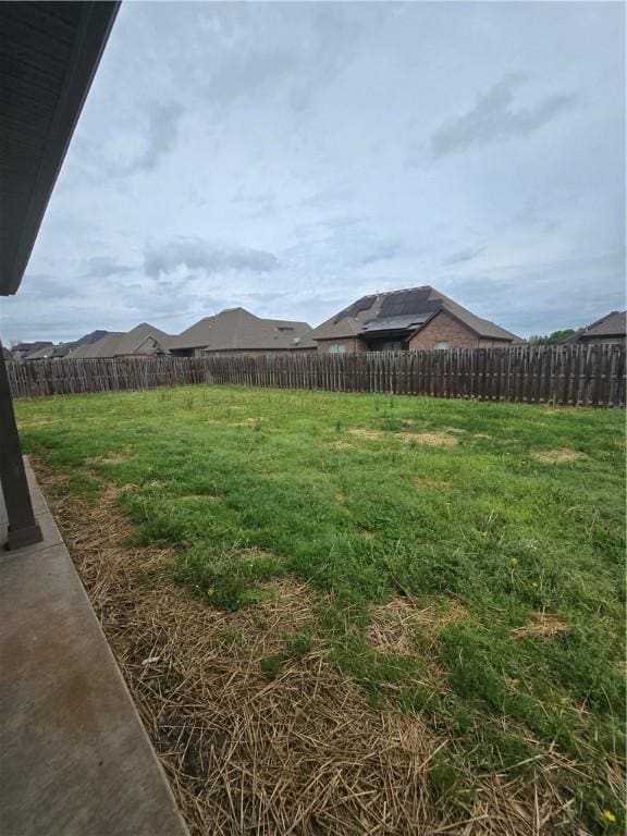 view of yard with a fenced backyard