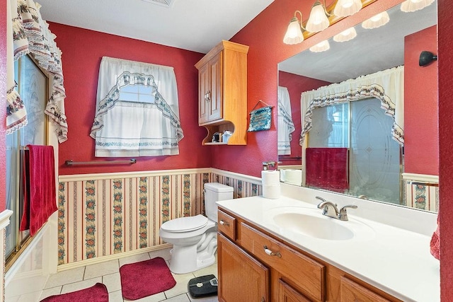full bath featuring toilet, a shower, tile patterned flooring, and vanity