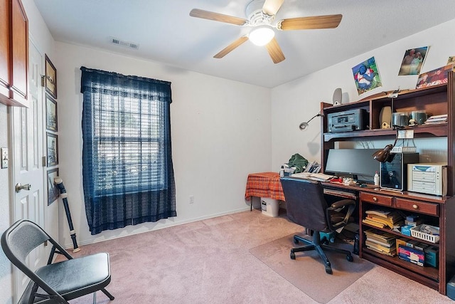 office with visible vents, baseboards, carpet floors, and ceiling fan