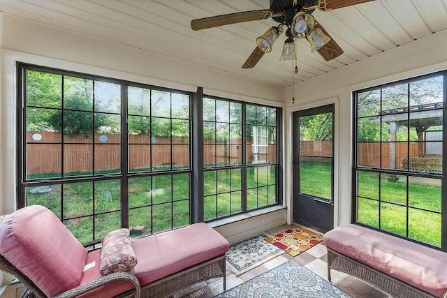 sunroom with a ceiling fan