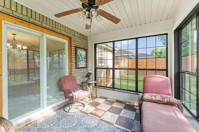 sunroom with ceiling fan