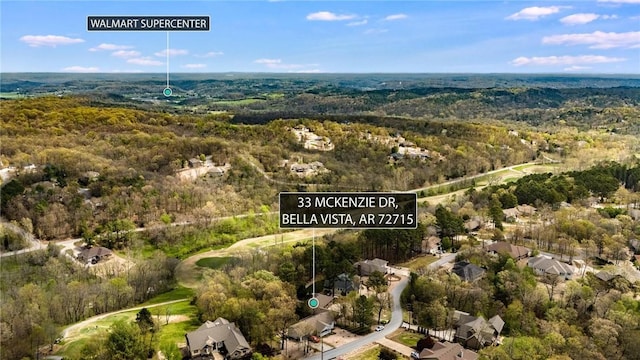 drone / aerial view featuring a view of trees