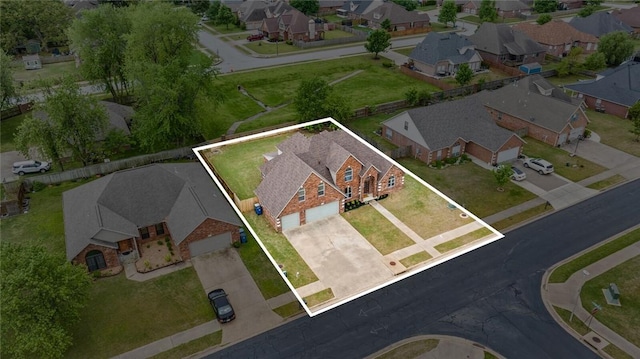 birds eye view of property with a residential view