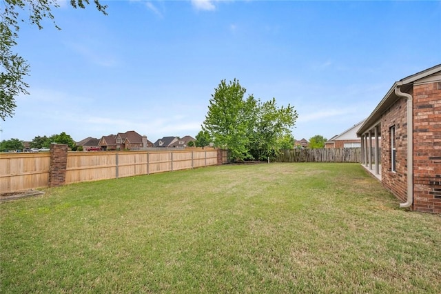 view of yard featuring a fenced backyard