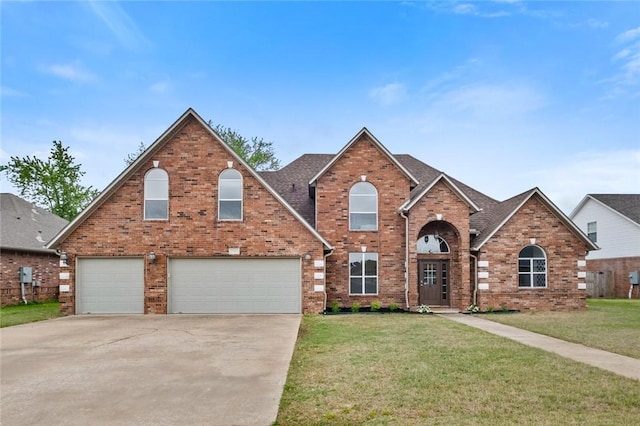 2003 SW Chinquapin Ave, Bentonville, AR 72713 - traditional-style home with a front lawn, brick siding, concrete driveway, a garage, and a shingled roof