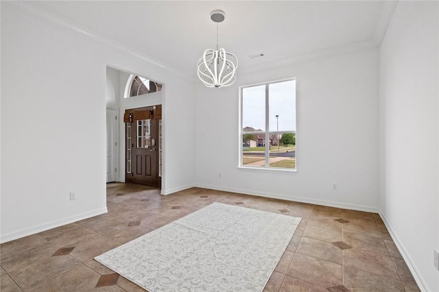 unfurnished dining area featuring crown molding, baseboards, tile patterned flooring, and a notable chandelier