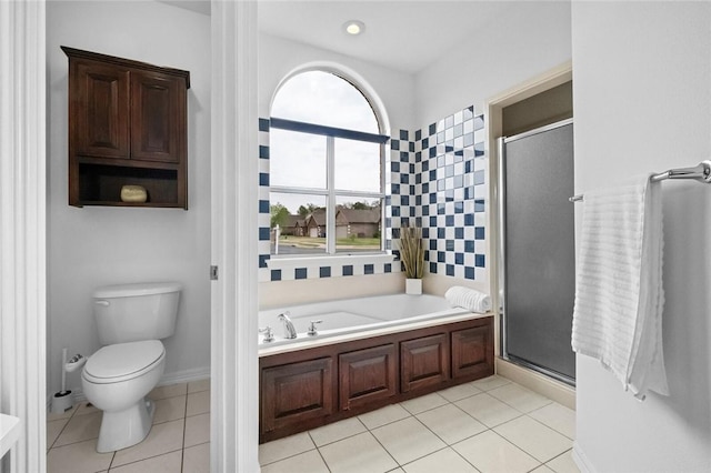 full bath featuring tile patterned floors, a bath, toilet, and a shower stall