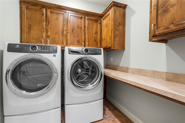 laundry area featuring cabinet space and washing machine and dryer