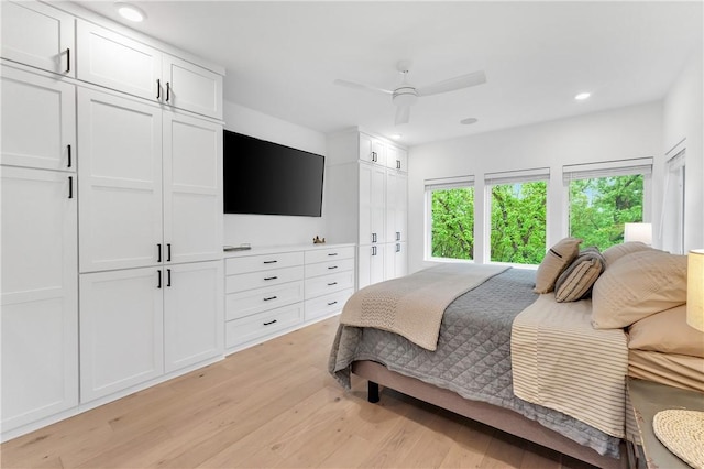 bedroom featuring recessed lighting, a ceiling fan, and light wood-style flooring