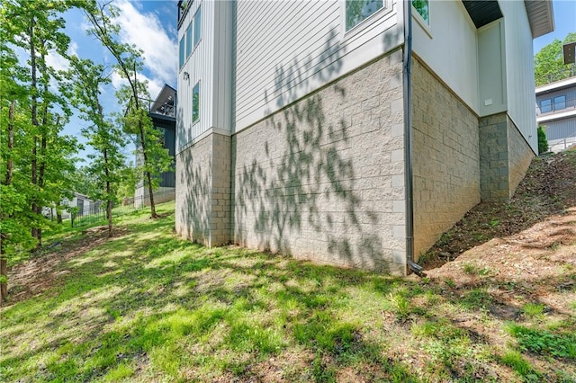 view of side of home featuring stone siding