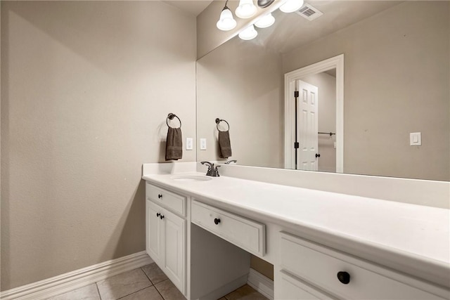bathroom featuring baseboards, tile patterned flooring, vanity, and visible vents