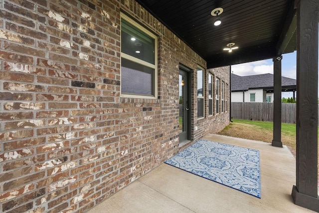 view of patio / terrace featuring fence