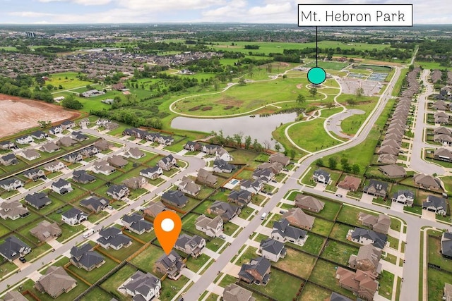 bird's eye view featuring a water view and a residential view