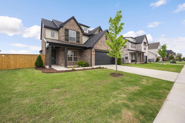 craftsman inspired home featuring brick siding, fence, driveway, and a front yard