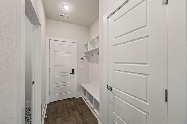 mudroom featuring recessed lighting, baseboards, dark wood finished floors, and visible vents
