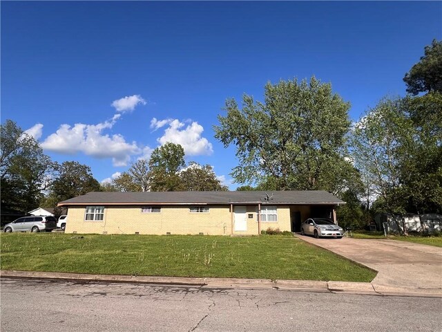 1813 Theodore Dr, Springdale, AR 72762 - ranch-style home with an attached carport, concrete driveway, and a front lawn