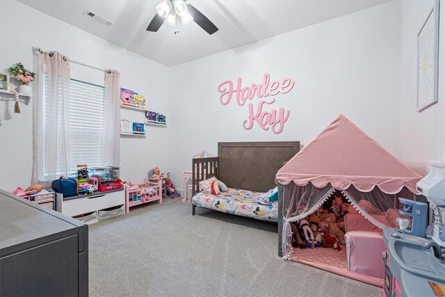 bedroom featuring carpet floors, ceiling fan, and visible vents