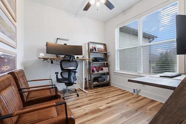 home office with baseboards, a ceiling fan, and wood finished floors