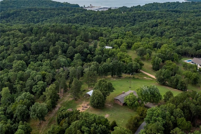 drone / aerial view featuring a view of trees