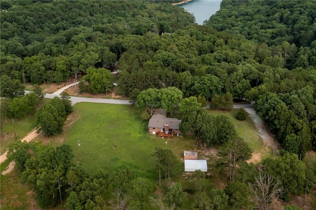 aerial view featuring a water view and a wooded view