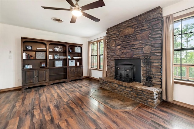unfurnished living room featuring baseboards, a ceiling fan, and wood finished floors