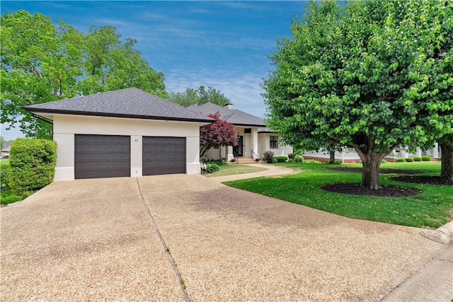 ranch-style home featuring roof with shingles, an attached garage, stucco siding, a front yard, and concrete driveway