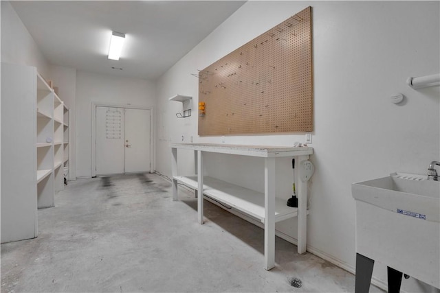 interior space featuring a sink and a workshop area