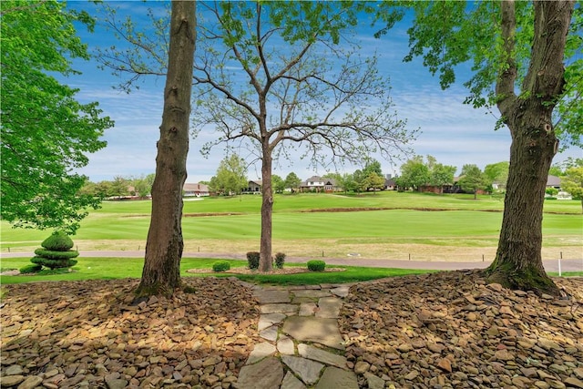 surrounding community with a lawn and golf course view