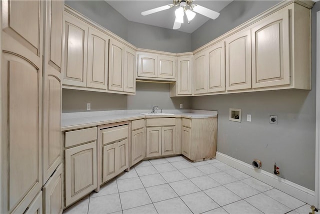 clothes washing area with cabinet space, ceiling fan, a sink, hookup for a washing machine, and hookup for a gas dryer