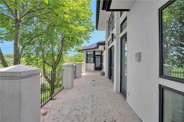 view of home's exterior featuring stucco siding and a balcony
