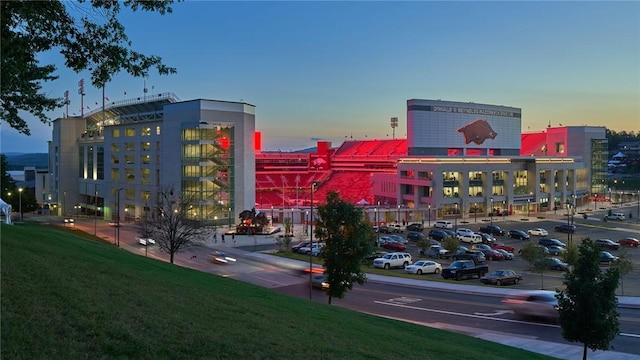 view of building exterior featuring uncovered parking