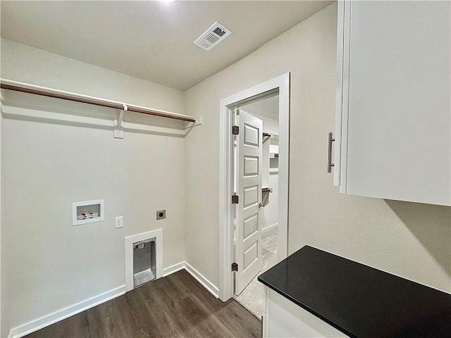 clothes washing area featuring laundry area, visible vents, dark wood-style flooring, hookup for a washing machine, and electric dryer hookup